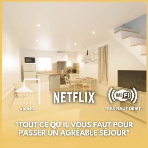 een woonkamer met een keuken en een trap bij Le Petit Canivet ultra cosy in Cerny