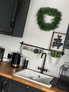 a kitchen counter with a sink in a kitchen at The Stables,Ashley in Ashley