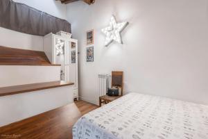 a bedroom with a bed and a star on the wall at Florence Star Apartment in Florence