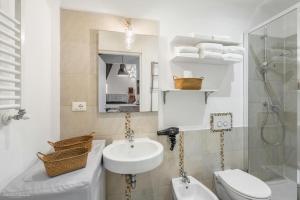 a bathroom with a sink and a toilet and a shower at Florence Star Apartment in Florence