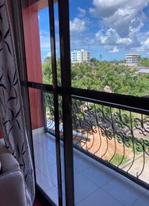 a room with a view from a window at TheGatsbyStyle By Jevas in Dar es Salaam
