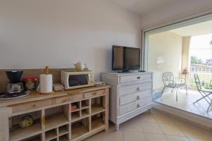 Kuchyň nebo kuchyňský kout v ubytování Résidence Eucalyptus - Appt avec terrasse