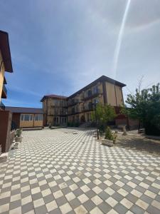 an empty parking lot in front of a building at Kherim 2 in Tuzla