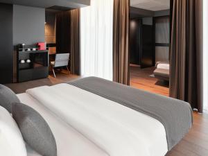 Posteľ alebo postele v izbe v ubytovaní Mövenpick Zagreb