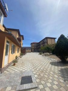 an empty courtyard with buildings in the background at Kherim 2 in Tuzla