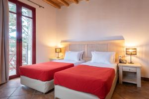 A bed or beds in a room at Lively Lofts by The Varos Residences