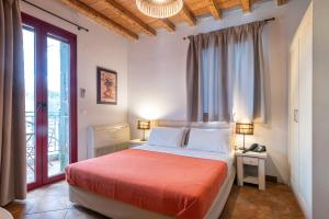 A bed or beds in a room at Lively Lofts by The Varos Residences