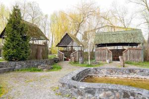 a group of buildings with a pond in front of it at Laguna in Luts'k