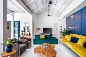 a living room with a couch and a table at The Beach House in Canggu