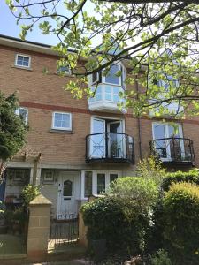 a brick house with balconies on the front of it at Townhouse at Harlepool Marina in Hartlepool