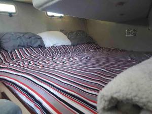 a bed in the back of a van at Waterfront 32' Bayliner Yacht in Providence