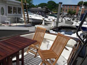 two chairs sitting on the deck of a boat at Waterfront 32' Bayliner Yacht in Providence