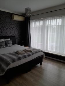 Voodi või voodid majutusasutuse Juliette's toas