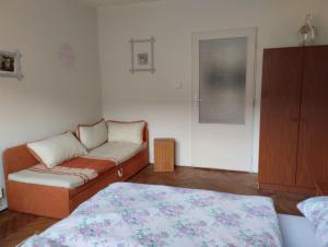 a living room with a couch and a bed at Štempel Karol , Bělá pod Pradědem, Domašov 412 in Jeseník