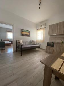 a large living room with a bed in the middle at Dream Catcher3 in Agia Theodoti