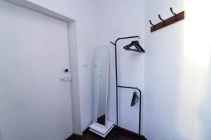 a white room with a shower and a glass door at City-central flat with sauna in Tallinn