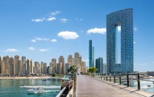 a view of a city with a pier and buildings at Address Beach Residence, JBR - Vacationer in Dubai