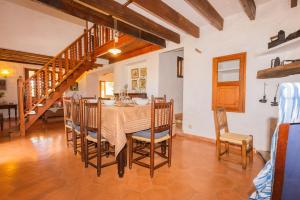 a dining room with a table and chairs at Hortella -Ecofinca- in Sant Joan