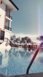 a swimming pool in a hotel with a resort at Hotel Erol - Adult Only in Ayvalık