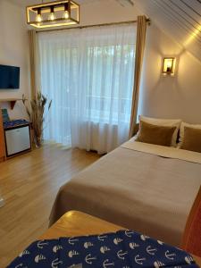 Postel nebo postele na pokoji v ubytování Willa Jack 4