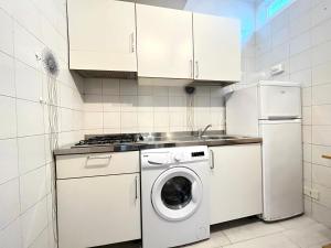 Kuchyň nebo kuchyňský kout v ubytování Imperiale Apartment
