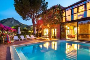 an image of a house with a swimming pool at La Boheme in Taormina