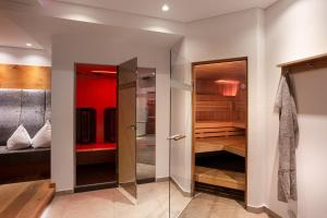 Postel nebo postele na pokoji v ubytování ALMHOF Alpin Apartments & Spa