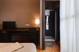 Ein Bett oder Betten in einem Zimmer der Unterkunft Atmosfere Milano Marittima