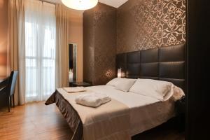 Ein Bett oder Betten in einem Zimmer der Unterkunft Atmosfere Milano Marittima