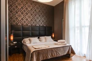 Ein Bett oder Betten in einem Zimmer der Unterkunft Atmosfere Milano Marittima