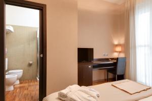 Ein Bett oder Betten in einem Zimmer der Unterkunft Atmosfere Milano Marittima
