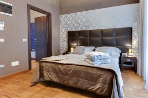 Ein Bett oder Betten in einem Zimmer der Unterkunft Atmosfere Milano Marittima