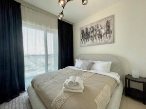 Fotografie z fotogalerie ubytování Dar Vacation - Cozy & Stylish 1BDR Apartment v Dubaji