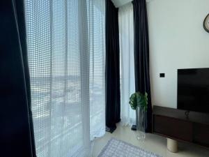 Fotografie z fotogalerie ubytování Dar Vacation - Cozy & Stylish 1BDR Apartment v Dubaji