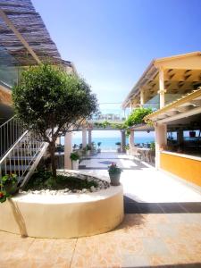 a view of the ocean from the lobby of a building at Romantic Palace Beach Apartments in Agios Gordios