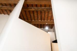 a view from the top of a white room with wooden ceilings at Appartamento Moderno Capoliveri in Capoliveri