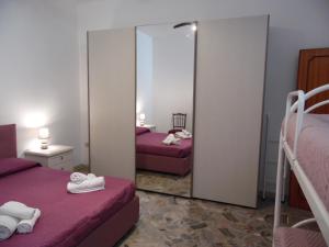 A bed or beds in a room at Casa Aurora
