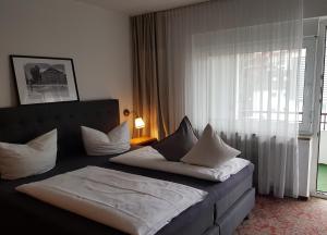 Postel nebo postele na pokoji v ubytování Apart Hotel Freiburg