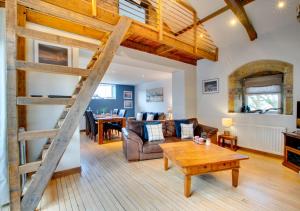 a living room with a couch and a table at Boca Chica Cottage in Cambois