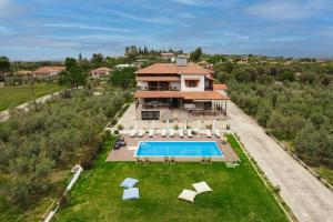 an aerial view of a house with a swimming pool at Kalisun Pool House by Georgalas in Nea Kalikratia