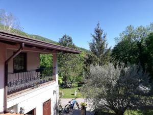 a bike parked on a balcony of a house at Pri Martinovih in Deskle