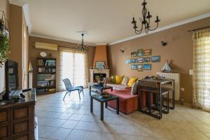 a living room with a couch and a table at Aurelia Apartment in Lixouri