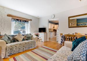 a living room with a couch and a table at Old Mill Branton in Glanton