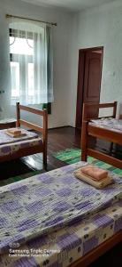 Cama o camas de una habitación en CycloCamp & Hostel