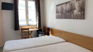 Postel nebo postele na pokoji v ubytování WEAA Hotel