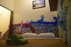 Postel nebo postele na pokoji v ubytování Pondok IJo Guesthouse