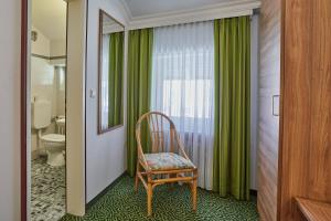 Koupelna v ubytování Hotel Lindenhof + 37 fotografií