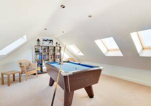 a pool table in a room with skylights at Twin Palms No 2 in North Sunderland
