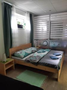 Postel nebo postele na pokoji v ubytování Apartmany Kras + 16 fotografií