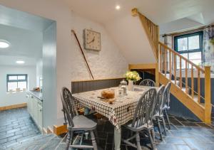 a dining room with a table and chairs at Little Dod Barn in Ilderton